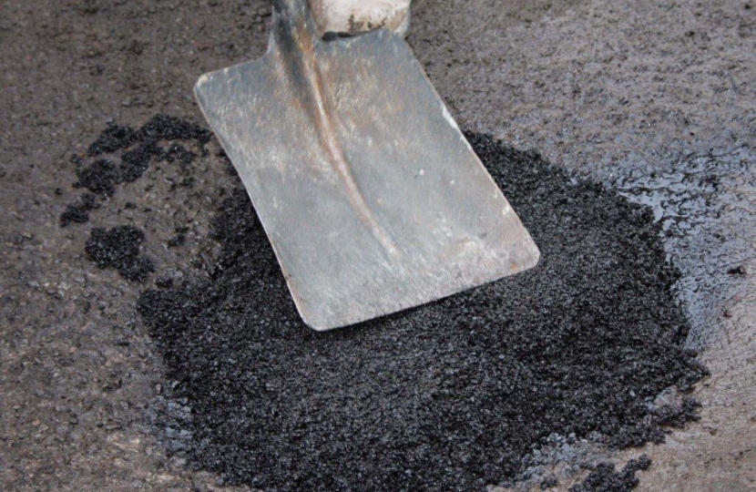 A Pothole being fixed